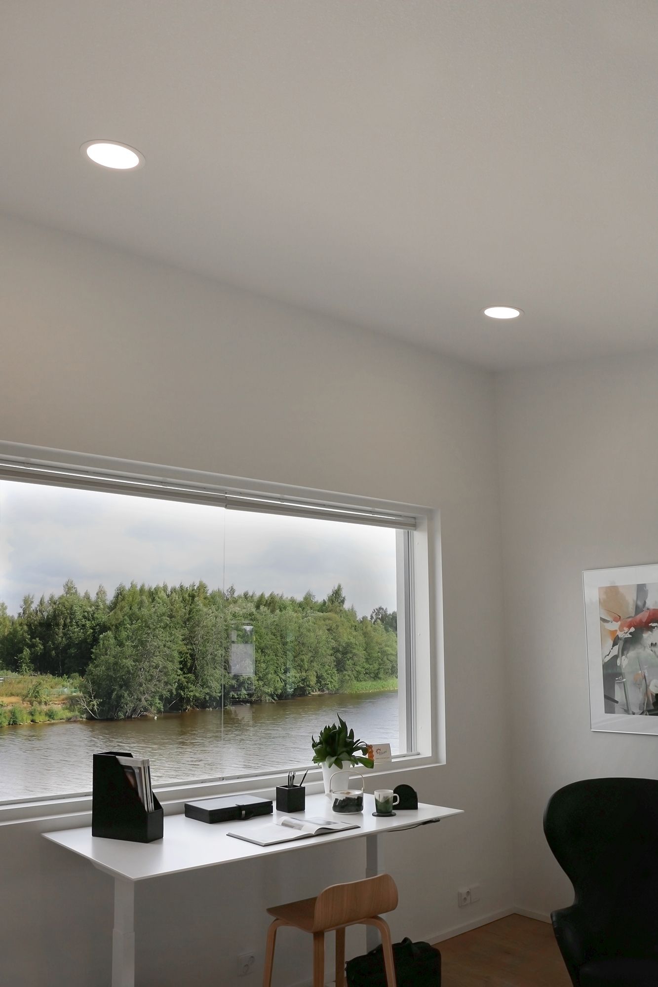 Plafondi luminaires illuminating a workspace. With an opening angle of 110 degrees, they provide a very even illumination. You can also find more sizes in our range. Ledstore.fi